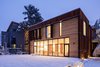 Modern home with Exterior, Metal Siding Material, Flat RoofLine, Metal Roof Material, and House Building Type. The venerable brick façade still greets the street as it has for 100 years, while the view from the mid-block alleyway behind the house reveals an unexpected expanse of rust-colored steel, natural wood, and glass. Photo 12 of Hillcrest House Addition: An Innovative Approach to Old + New