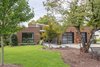 Modern home with Exterior, House Building Type, Metal Siding Material, Metal Roof Material, Flat RoofLine, and Wood Siding Material. A one-story form faces the public street. Photo of The Thomas Residence