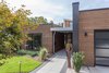 Modern home with Exterior, House Building Type, Metal Roof Material, Flat RoofLine, Wood Siding Material, and Metal Siding Material. The main entrance. Photo 2 of The Thomas Residence