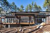 Modern home with Exterior, House Building Type, Metal Roof Material, and Flat RoofLine. A generous cantilevered screened porch appears as if it’s floating above the natural landscape. Clerestory windows, seen beneath the upper roof, bring natural light into the center of the house.
Photo 3 of The Mason-Grabell "Beech" House