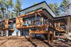 Modern home with Exterior, House Building Type, Flat RoofLine, Glass Siding Material, Wood Siding Material, and Metal Roof Material. A wrap-around deck provides more outdoor living space and connects the screen porch to an outdoor grilling area.
Photo 4 of The Mason-Grabell "Beech" House