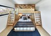 Modern home with Bedroom, Medium Hardwood Floor, Accent Lighting, Bed, and Light Hardwood Floor. Custom birch plywood bunkbed Photo 14 of Laurentian Ski Chalet