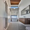 Modern home with Bath Room, Recessed Lighting, Wall Lighting, Accent Lighting, Ceiling Lighting, Ceramic Tile Floor, Engineered Quartz Counter, Two Piece Toilet, Drop In Sink, Subway Tile Wall, Porcelain Tile Wall, Ceramic Tile Wall, Wall Mount Sink, Porcelain Tile Floor, and One Piece Toilet. Master bath Photo 11 of Laurentian Ski Chalet