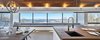 Modern home with Dining Room, Bench, Table, Ceiling Lighting, Accent Lighting, Storage, Light Hardwood Floor, Wall Lighting, Medium Hardwood Floor, Pendant Lighting, and Recessed Lighting. 27' Bay window seat. Photo 8 of Laurentian Ski Chalet
