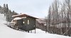 Modern home with Exterior, Wood Siding Material, Metal Roof Material, House Building Type, Shed RoofLine, and Cabin Building Type. View of chalet from entry drive. Photo of Laurentian Ski Chalet