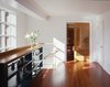 Modern home with Storage Room and Shelves Storage Type. Custom American cherry pocket doors lead to the dining room. By RobitailleCurtis Photo 7 of Fitler Square House & Garden
