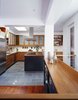 Pennsylvania bluestone flooring, American cherry cabinets, Ann Sacks tile backsplash, and a skylight in the right place make for an inviting place to cook and entertain. By RobitailleCurtis Photo 5 of Fitler Square House & Garden modern home