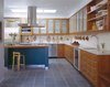 A Pennsylvania bluestone floor with radiant heating, American cherry cabinets, and Ann Sacks tile backsplash, and abundant daylight make for a nice place to cook and entertain. By RobitailleCurtis Photo 4 of Fitler Square House & Garden modern home