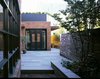 A view towards the new kitchen addition and hidden garden. Herringbone brick pavers and Pennsylvania bluestone play nicely with the historic brick of the original 1860's townhome. Photo 2 of Fitler Square House & Garden modern home