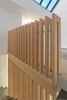 Detail of the douglas fir guardrail at the third floor level. Photo 12 of Atrium Townhome modern home
