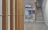 Modern home with Living Room, Concrete Floor, Accent Lighting, Storage, Ceiling Lighting, and Recessed Lighting. View from entry. Photo 3 of Atrium Townhome
