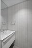 Modern home with Concrete Floor, Recessed Lighting, and Engineered Quartz Counter. Powder room contained in lacquered wood 'cube' on first floor. Photo 20 of Atrium Townhome