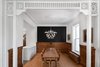 Modern home with Dining Room, Table, Medium Hardwood Floor, Storage, Ceiling Lighting, Pendant Lighting, and Chair. Renovated dining room with newly expanded opening to kitchen. Photo of Winchester Residence