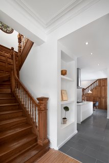 RobitailleCurtis renovated the entry hall, dining room, and kitchen of the Winchester Residence. Thankfully, they kept the sweeping wooden Victorian staircase intact.