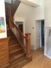 View before the renovations from the stair & entry hall looking toward the kitchen entry and the powder room. Photo 11 of Winchester Residence modern home