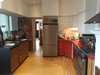 A view of the kitchen looking back toward the entry hall before the renovations. Photo 13 of Winchester Residence modern home