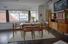 The dining room windows look out over the unique rooflines of this historic area. Painting over the buffet by Andrew Rucklidge, "Seedcatcher" sculpture by Kathryn Lipke. Photo 4 of A Penthouse gets reincarnated - from the 19th Century to the 21st modern home