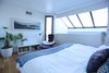 Upstairs a light-filled bedroom looks up to the sky. Photo 9 of A Penthouse gets reincarnated - from the 19th Century to the 21st modern home