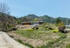 Modern home with Outdoor, Front Yard, Trees, Grass, and Flowers. distant view Photo 10 of Apple Farm House