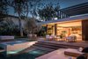 Located in the Pacific Palisades neighborhood of Los Angeles, the Amalfi Drive Residence is a modernist villa. Designed in a “Z” formation with separate public and private wings, the 16,000-square-foot property has both ocean and golf course views. The lavish home features six bedrooms with their own baths, enclosed parking for three cars, a dedicated maids quarters, a full guest suite, a basement gym with a private patio, a wine cellar, and a 12-seat theater. Photo 3 of Amalfi Drive Residence modern home