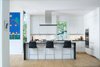 An open floor plan with uninterrupted views from the front to the back of the home provides a stark transformation from the original “boxy” floor plan. Designed to cater to university events as well as day-to-day routines of the home’s residents, Meade notes that the first floor was designed so that “only one room can close itself off in order to create visual and physical openess. If you are hosting events, you can have everyone in a single space, but still have them in different “spaces.” Photo 3 of Modern Victorian modern home