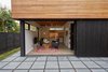 Modern home with Exterior. The 16' western window 6000 series glass multislide opens up the space on nice days. Photo 16 of The Mansfield Frogner House
