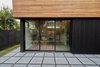 Modern home with Exterior. I built a moveable slat slider to provide some privacy and shading to the main room Photo 17 of The Mansfield Frogner House