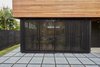 Modern home with Exterior. I built a moveable slat slider to provide some privacy and shading to the main room Photo 19 of The Mansfield Frogner House