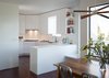 Modern home with Kitchen, Microwave, Cooktops, Ice Maker, Ceiling Lighting, Engineered Quartz Counter, Range Hood, Refrigerator, Undermount Sink, Stone Slab Backsplashe, Dark Hardwood Floor, Dishwasher, and White Cabinet. Kitchen Photo 4 of SF House-Tech-Art-Play