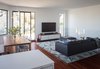 Modern home with Living Room, Sofa, Ceiling Lighting, Dark Hardwood Floor, and Ottomans. Living room Photo 5 of SF House-Tech-Art-Play