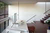 Modern home with Office, Study Room Type, Storage, Chair, Shelves, Dark Hardwood Floor, and Desk. Home office at mezzanine Photo 8 of SF House-Tech-Art-Play
