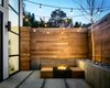 Modern home with Outdoor, Small Patio, Porch, Deck, Walkways, Shrubs, Concrete Patio, Porch, Deck, Landscape Lighting, Hardscapes, Wood Fences, Wall, Raised Planters, Trees, Back Yard, and Hanging Lighting. Back patio Photo 11 of SF House-Tech-Art-Play
