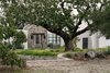 Modern home with Outdoor, Front Yard, Trees, Garden, Shrubs, and Raised Planters. Majestic Valley Oak at home's main entrance Photo of Hilltop Haven
