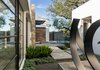 Modern home with Outdoor, Hardscapes, Walkways, Shrubs, Landscape Lighting, and Side Yard. Sculpture courtyard and lighted pathway Photo 3 of Hilltop Haven
