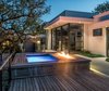 Modern home with Outdoor, Wood Patio, Porch, Deck, Small Pools, Tubs, Shower, Concrete Patio, Porch, Deck, Trees, Shrubs, Small Patio, Porch, Deck, Hardscapes, Back Yard, and Landscape Lighting. Lighted spa and fire feature at twilight Photo 7 of Hilltop Haven
