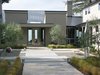 Modern home with Outdoor, Front Yard, Grass, Shrubs, Trees, Hardscapes, Gardens, Concrete Patio, Porch, Deck, Stone Patio, Porch, Deck, and Pavers Patio, Porch, Deck. Courtyard leading to the front door Photo of Hideaway View