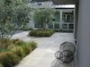 Modern home with Outdoor, Back Yard, Grass, Shrubs, Trees, Hardscapes, Gardens, and Walkways. Entry landing Photo 2 of Hideaway View