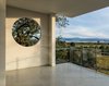 Modern home with Outdoor, Trees, Hardscapes, and Concrete Patio, Porch, Deck. Framed views of the surrounding landscape from main floor level Photo 12 of Hilltop Haven