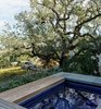Modern home with Outdoor, Decking Patio, Porch, Deck, Trees, Small Pools, Tubs, Shower, and Shrubs. Master bedroom courtyard spa sited above the vineyard Photo 17 of Hilltop Haven
