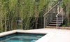 Modern home with Outdoor, Small Pools, Tubs, Shower, Shrubs, Hardscapes, Back Yard, Stone Patio, Porch, Deck, and Metal Fences, Wall. The spa, tiled with glass the color of the sea, is located in an intimate space midway between the main level of the house and the guest quarters below. Here, a multi-level terrace and a large built-in bench provide room to circulate, lounge or drop a towel before stepping down into the warm water. Photo 10 of On the Edge