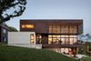 Modern home with Exterior, Wood Siding Material, Stucco Siding Material, House Building Type, and Flat RoofLine. Modern Lodge, exterior - The design approach of the site is to connect
the house to the land Photo of Modern Lodge