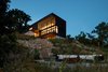 Modern home with Exterior, House Building Type, Cabin Building Type, and Flat RoofLine. Modern Lodge in the evening Photo 11 of Modern Lodge