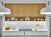Modern home with Kitchen, Marble Counter, Wood Cabinet, White Cabinet, Stone Slab Backsplashe, and Pendant Lighting. Kitchen Photo 6 of The Historic Ely Building