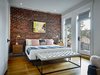 Modern home with Bedroom and Light Hardwood Floor. Master Bedroom Photo 10 of The Historic Ely Building