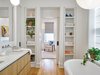 Modern home with Bath Room, Light Hardwood Floor, Stone Counter, Freestanding Tub, Enclosed Shower, and Undermount Sink. Master Bathroom Photo 12 of The Historic Ely Building
