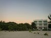 As the sun sets over the Gulf of Mexico, the moon rises above the Biosphere of Celestun Photo 2 of Playa 55 modern home