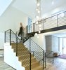 Modern home with Staircase, Wood Tread, and Metal Railing. Feature Stair after re-model Photo 4 of Crestwood Re-Model