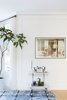 Modern home with Living Room, Bar, and Light Hardwood Floor. Bar cart and photographic art. Photo 6 of Sea Cliff Preppy Contemporary