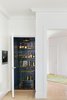 Modern home with Light Hardwood Floor. Elevator with hand painted mural and brass bar cart. Photo 11 of Sea Cliff Preppy Contemporary