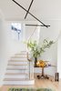 Modern home with Hallway. Foyer with heirloom pedestal table and modern light fixture. Photo of Sea Cliff Preppy Contemporary